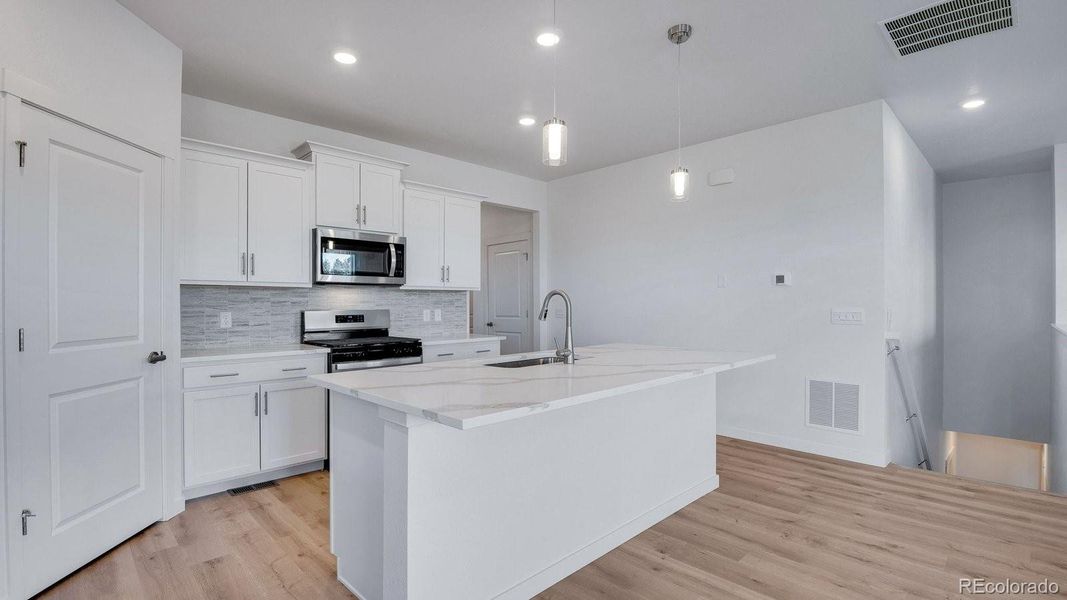 Furnished interior view inside a new home in Trails at Crowfoot, Parker (Image 11).
