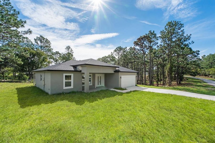 Front exterior of a new home in , Dunnellon, FL, highlighting curb appeal (Image 19). Front exterior of a new home in , Dunnellon, FL, highlighting curb appeal (Image 19).