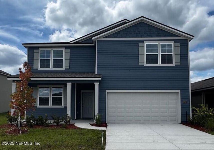 Front exterior of a new home in The Arbors, Jacksonville, FL, highlighting curb appeal (Image 30).