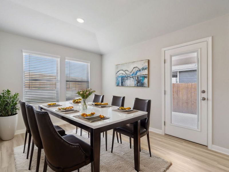 Virtually staged dining room in the Briscoe floorplan at a Meritage Homes community. Virtually staged dining room in the Briscoe floorplan at a Meritage Homes community.