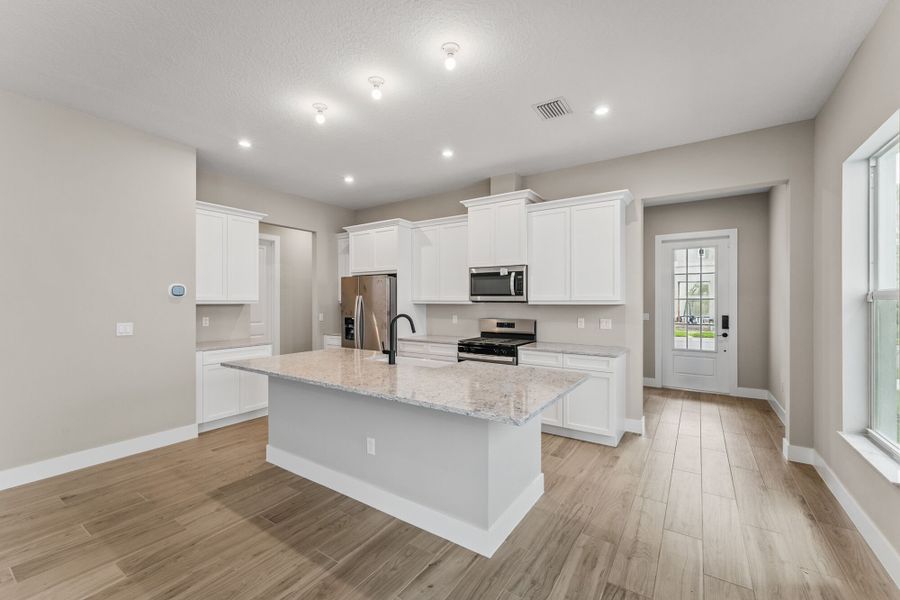 Representative furnished interior of a home built from the Monarch by Mattamy Homes in Newfield, Palm City (Image 4).
