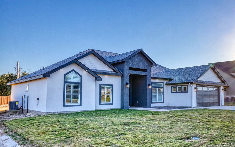 Front exterior of a new home in , Uvalde, TX, highlighting curb appeal (Image 2).