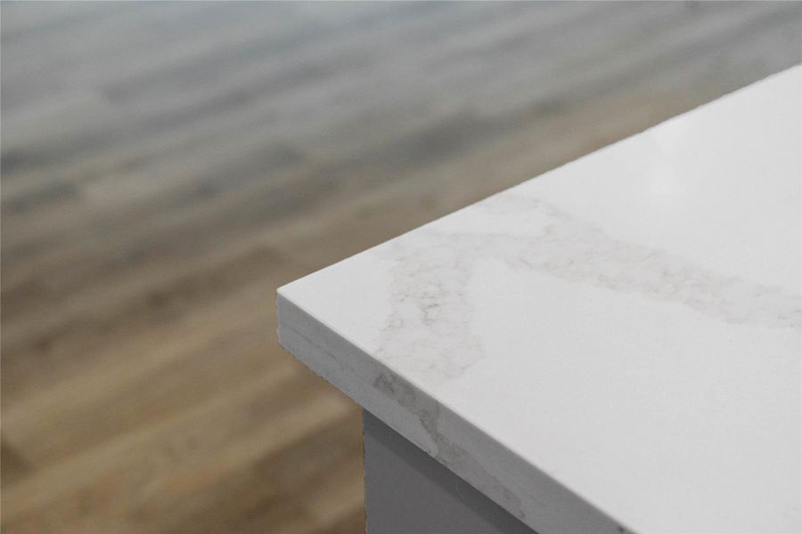 This striking quartz countertop combines the elegant, deep-veined look of natural stone with a highly durable, non-porous surface that is exceptionally resistant to scratches, stains, and daily wear. This striking quartz countertop combines the elegant, deep-veined look of natural stone with a highly durable, non-porous surface that is exceptionally resistant to scratches, stains, and daily wear.