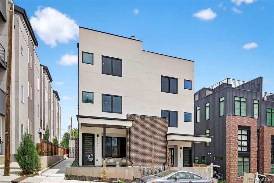 Front exterior of a new home in , Denver, CO, highlighting curb appeal (Image 1).