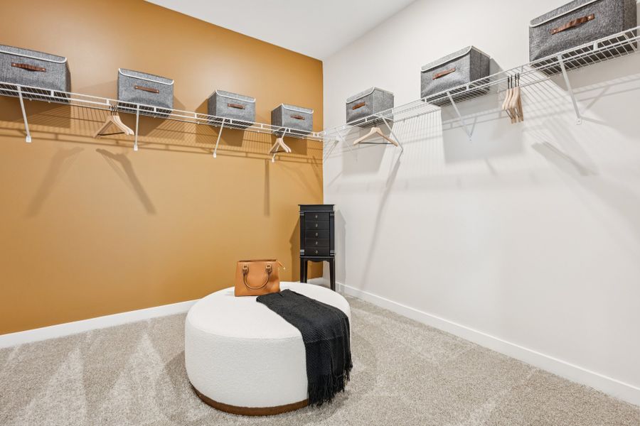 A room with a bed and a chair.