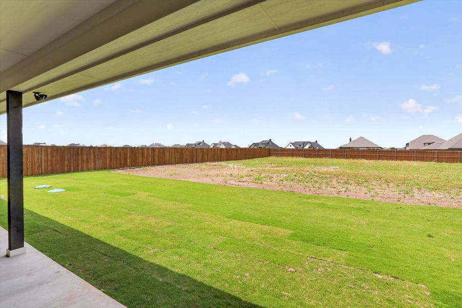 Front exterior of a new home in Coyote Crossing, Godley, TX, highlighting curb appeal (Image 24).