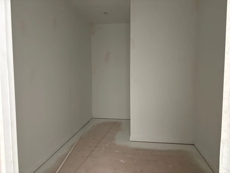 Primary Walk-In featuring the AW Collection® Serene - Open storage with understated design. Primary Walk-In featuring the AW Collection® Serene - Open storage with understated design.