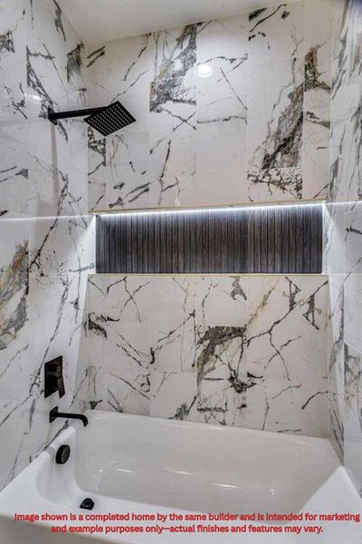 Full bath featuring a combined bath / shower with marble appearance Full bath featuring a combined bath / shower with marble appearance