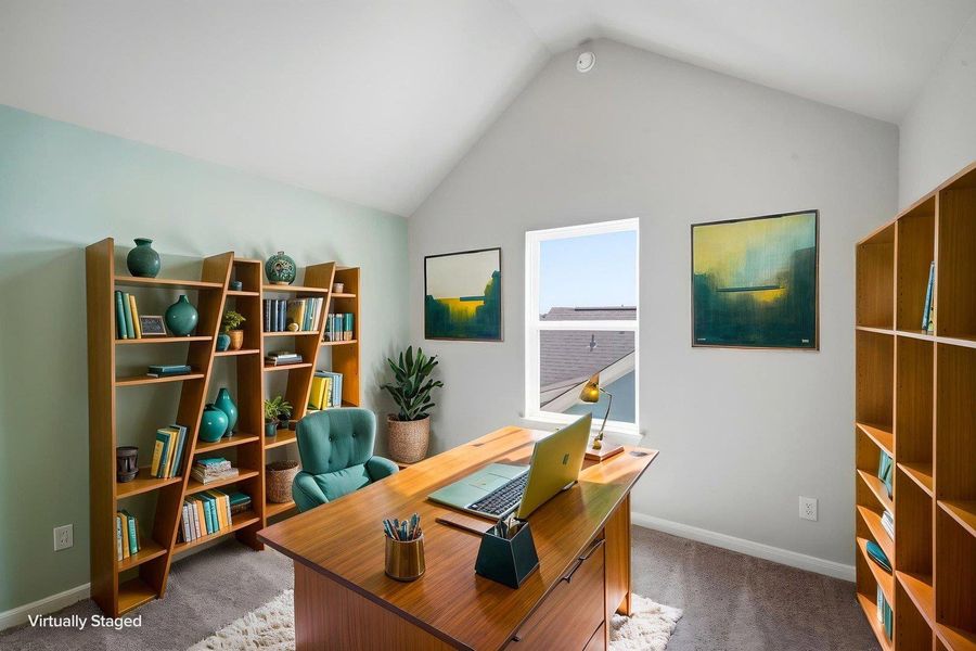 Vaulted ceilings and plush carpeting define this versatile home workspace. Vaulted ceilings and plush carpeting define this versatile home workspace.