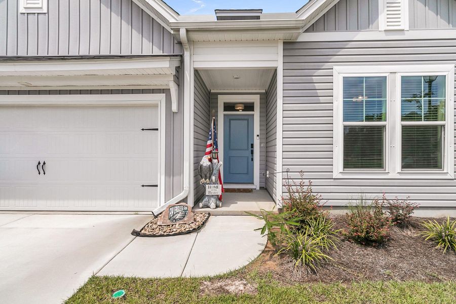 Front exterior of a new home in The Groves of Berkeley, Moncks Corner, SC, highlighting curb appeal (Image 19).