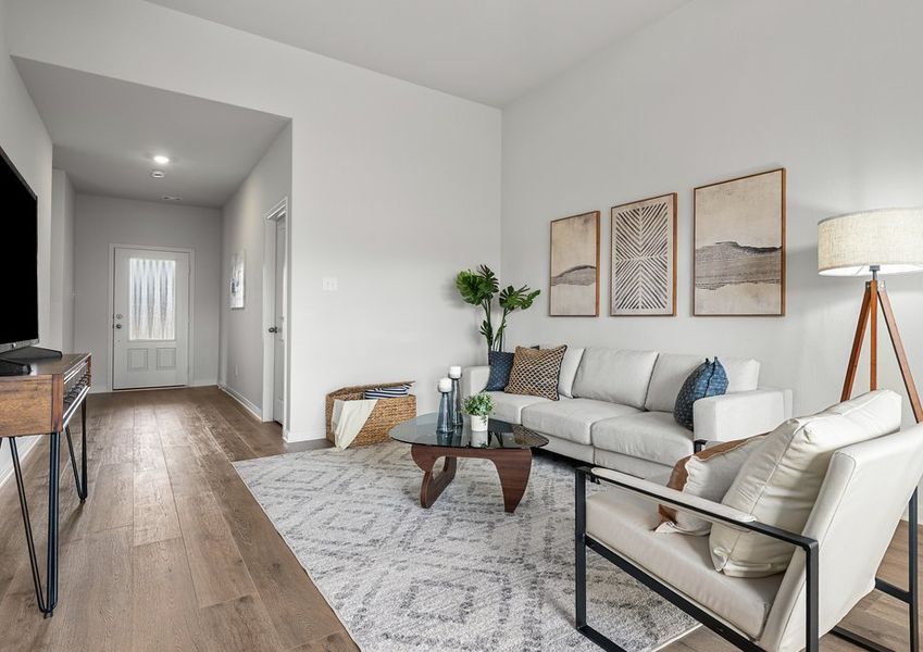The living room has plenty of space for furniture. The living room has plenty of space for furniture.