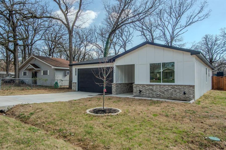 Front exterior of a new home in , Gun Barrel City, TX, highlighting curb appeal (Image 25).