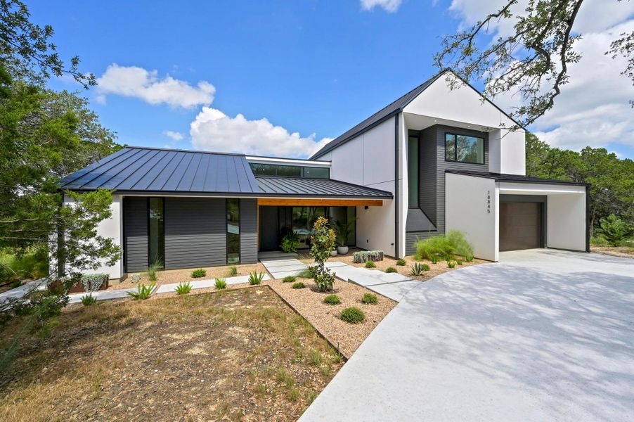 Front exterior of a new home in , Jonestown, TX, highlighting curb appeal (Image 25). Front exterior of a new home in , Jonestown, TX, highlighting curb appeal (Image 25).