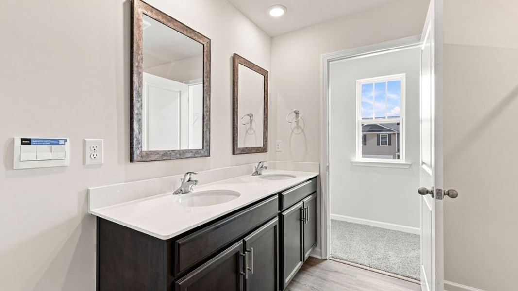 Furnished interior view inside a new home in Bentley Park, Greenwood (Image 12).