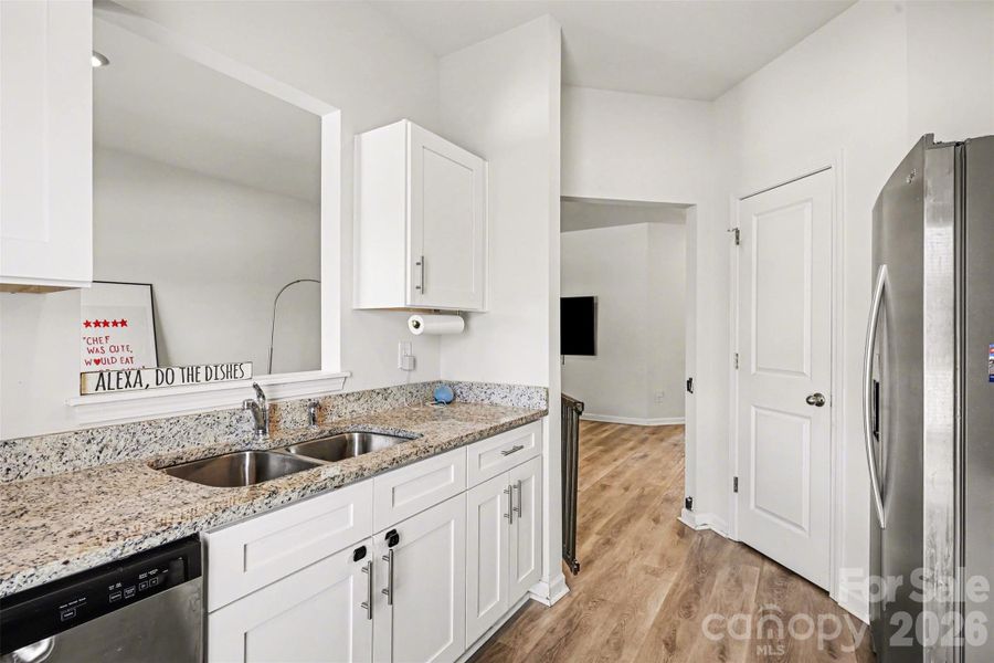 Primary Bath with granite counters and soft lose cabinets.