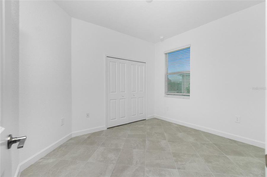 Spacious, unfurnished interior of a new home in Island Lakes at Coco Bay: Villas, Englewood (Image 27).