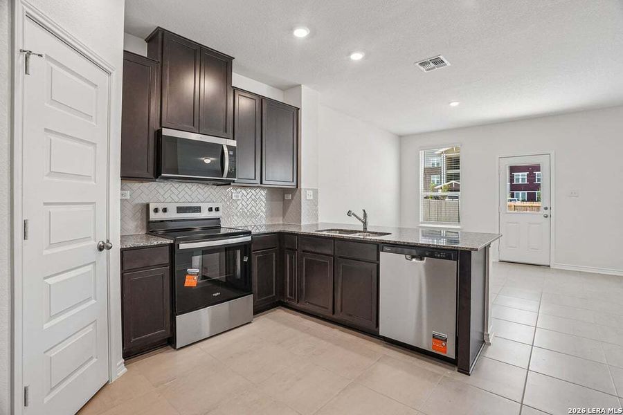 Furnished interior view inside a new home in Medina Crossing, Von Ormy (Image 9).