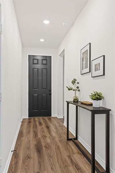 8' front door welcomes you in to this stunning home with LVP flooring!