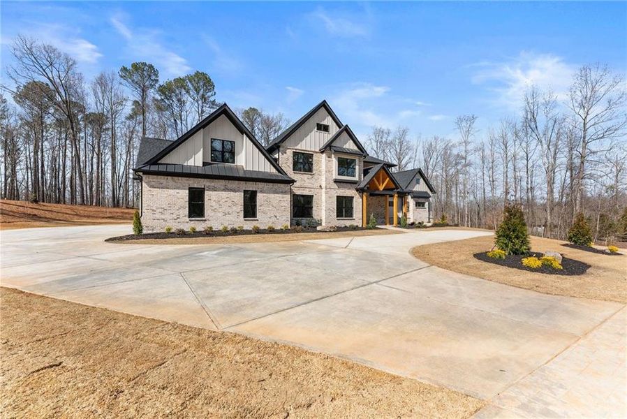 Front exterior of a new home in , Hoschton, GA, highlighting curb appeal (Image 28). Front exterior of a new home in , Hoschton, GA, highlighting curb appeal (Image 28).