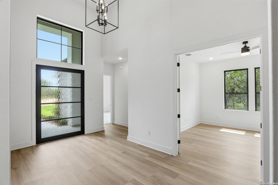 Spacious, unfurnished interior of a new home in Enchanted Bluff, San Antonio (Image 41).