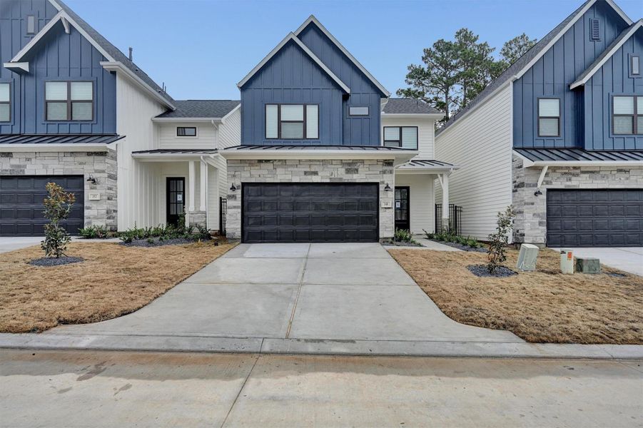 Front exterior of a new home in Summer Place  35', Montgomery, TX, highlighting curb appeal (Image 26).