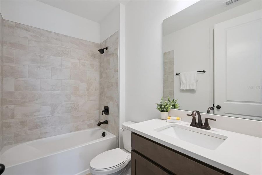 Furnished interior view inside a new home in Laureate Park, Orlando (Image 32).