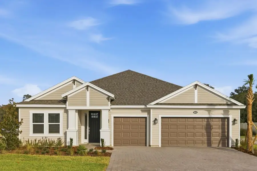 Front exterior of a new home in Headwaters at Lofton Creek, Yulee, FL, highlighting curb appeal (Image 1).