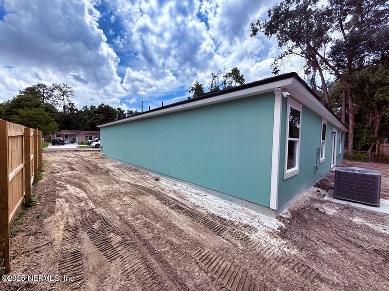Front exterior of a new home in , Jacksonville, FL, highlighting curb appeal (Image 9).