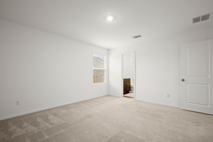 The primary suite comes with its own private ensuite bathroom with a walk-in closet.