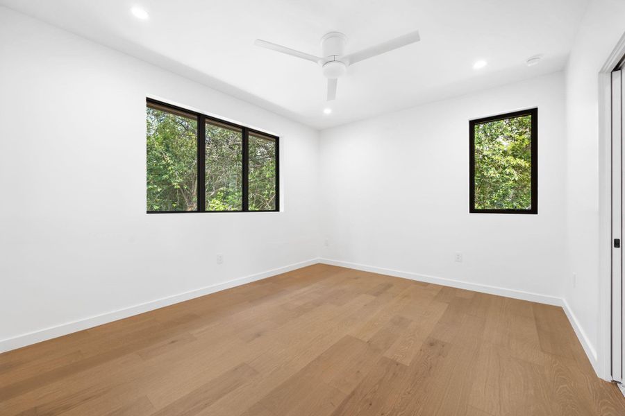 Spare room featuring light wood-style flooring, recessed lighting, and ceiling fan