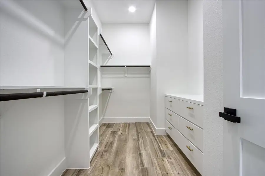 Primary closet with lots of built ins! Primary closet with lots of built ins!