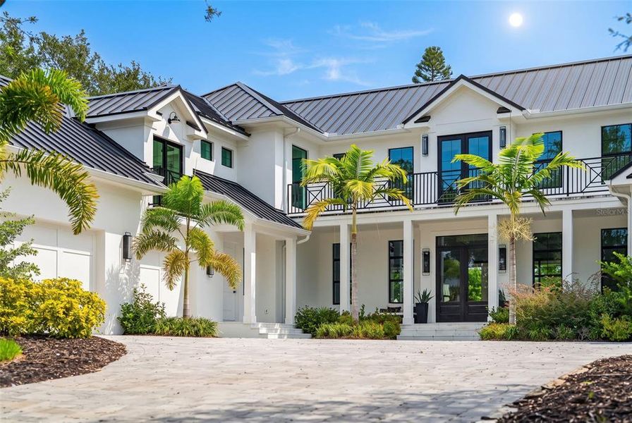 Front exterior of a new home in , Sarasota, FL, highlighting curb appeal (Image 1). Front exterior of a new home in , Sarasota, FL, highlighting curb appeal (Image 1).