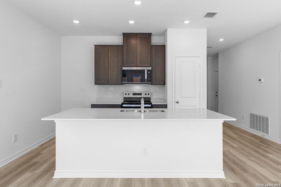 Furnished interior view inside a new home in Hidden Bluffs at TRP, San Antonio (Image 8).
