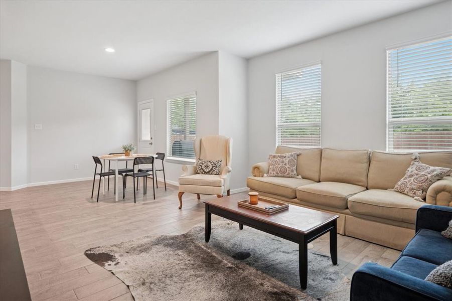 Bright and open living areas with windows overlooking the backyard. Bright and open living areas with windows overlooking the backyard.