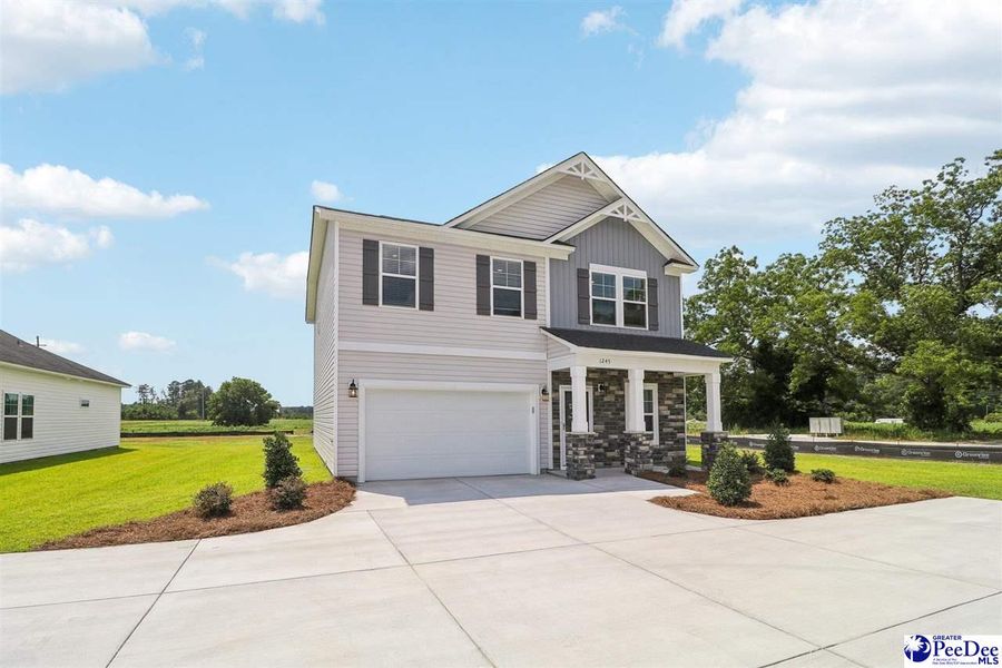 Front exterior of a new home in Southern Columns, Florence, SC, highlighting curb appeal (Image 23).