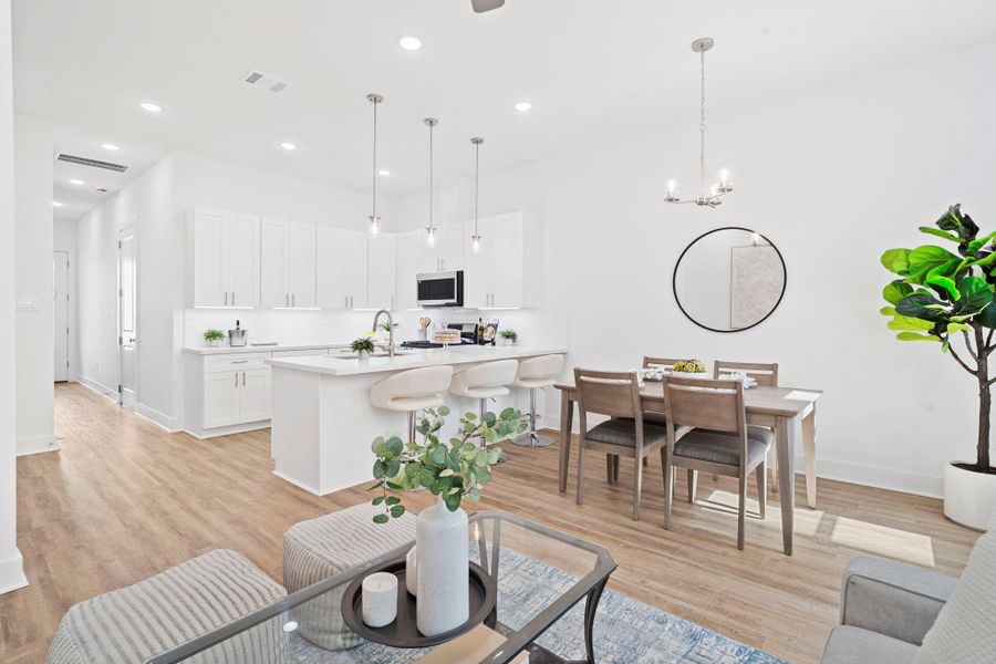 No visible outlets along the backsplash - cleverly hidden under the cabinets