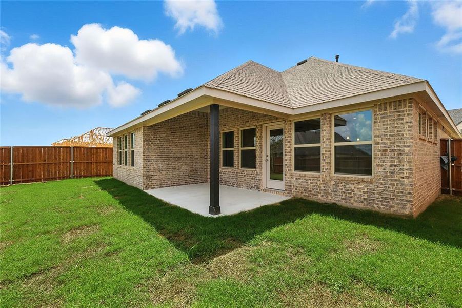 Back of house featuring brick siding, a patio, a fenced backyard, and a shingled roof Back of house featuring brick siding, a patio, a fenced backyard, and a shingled roof