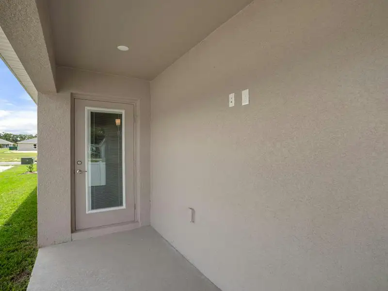 A covered lanai provides a desirable outdoor living space.