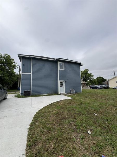 Two-story exterior with blue horizontal siding and white trim Two-story exterior with blue horizontal siding and white trim