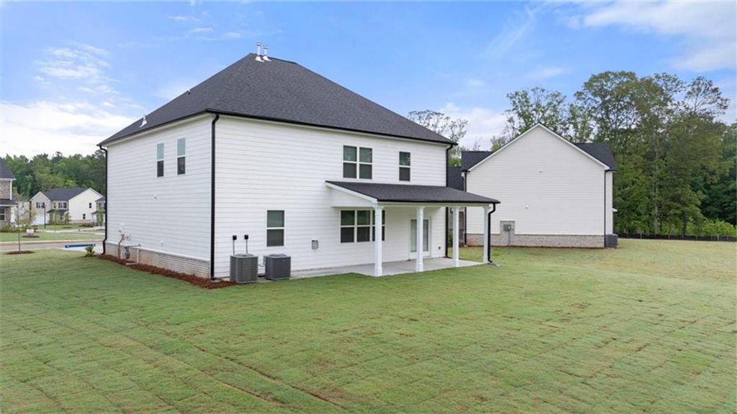 Front exterior of a new home in Independence, Loganville, GA, highlighting curb appeal (Image 2).
