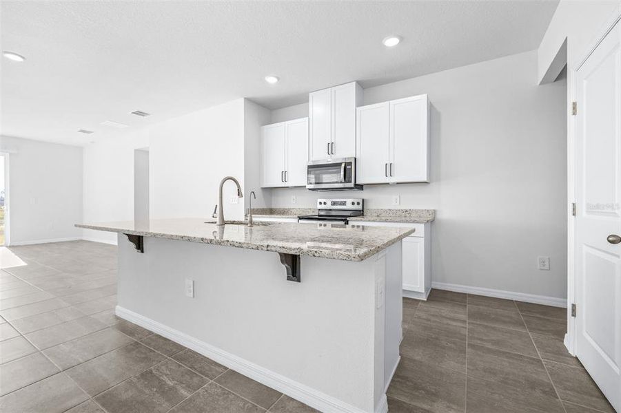 Furnished interior view inside a new home in The Grove at Stuart Crossing - Premier Series, Bartow (Image 7).