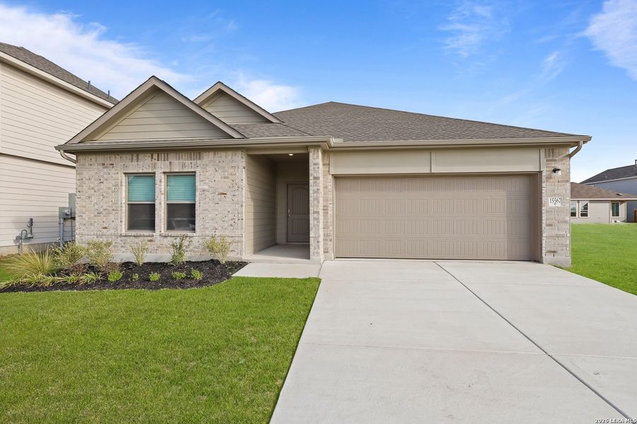 Front exterior of a new home in Summerlin, Castroville, TX, highlighting curb appeal (Image 1). Front exterior of a new home in Summerlin, Castroville, TX, highlighting curb appeal (Image 1).