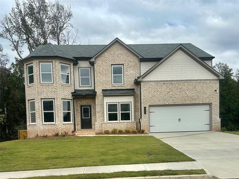 Front exterior of a new home in , Auburn, GA, highlighting curb appeal (Image 1).