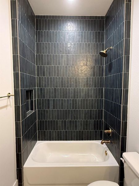 Bathroom with toilet and shower / bathtub combination