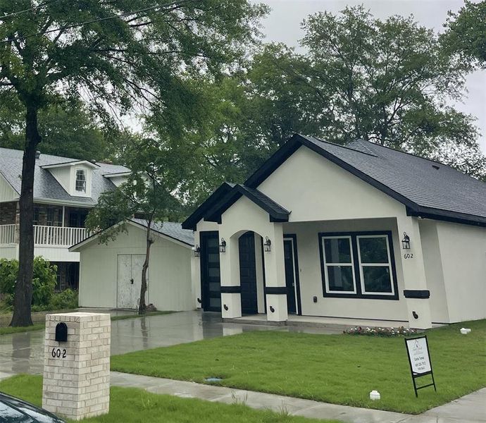 Front exterior of a new home in , Terrell, TX, highlighting curb appeal (Image 4).