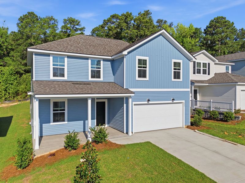 Front exterior of a new home in Grand Arbor, Blythewood, SC, highlighting curb appeal (Image 2). Front exterior of a new home in Grand Arbor, Blythewood, SC, highlighting curb appeal (Image 2).