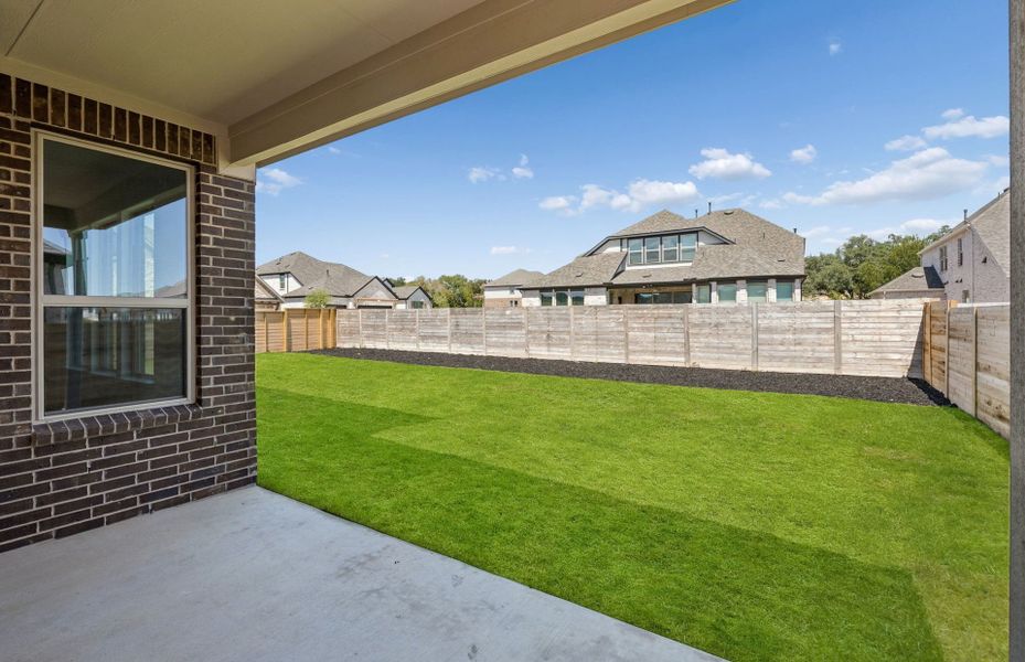 Exterior details and patio area of a home in Bluffview Reserve, Leander (Image 29).