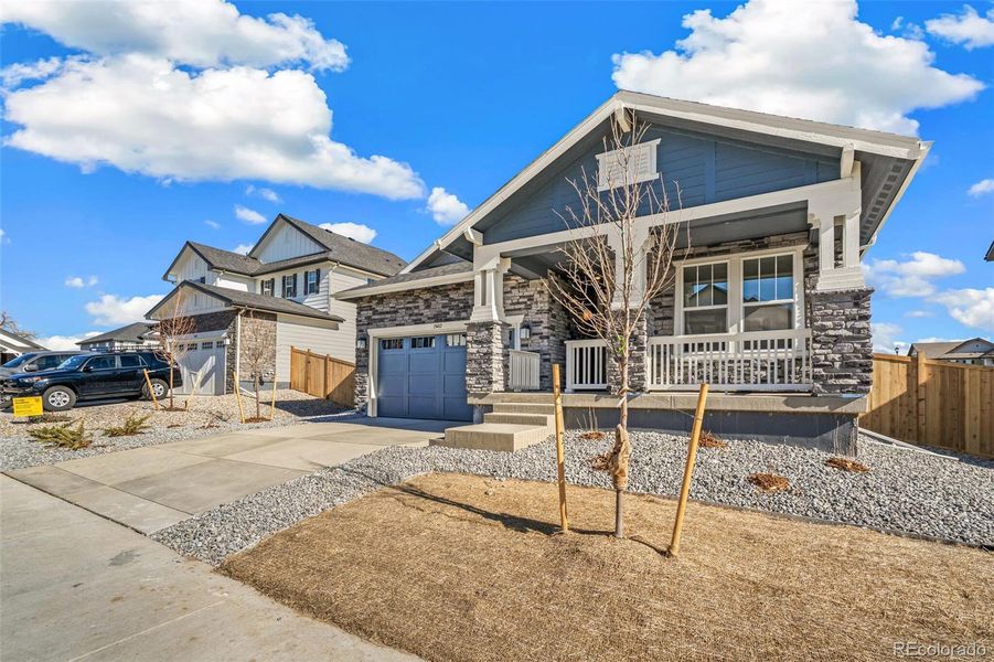 Front exterior of a new home in Windsong, Brighton, CO, highlighting curb appeal (Image 22). Front exterior of a new home in Windsong, Brighton, CO, highlighting curb appeal (Image 22).