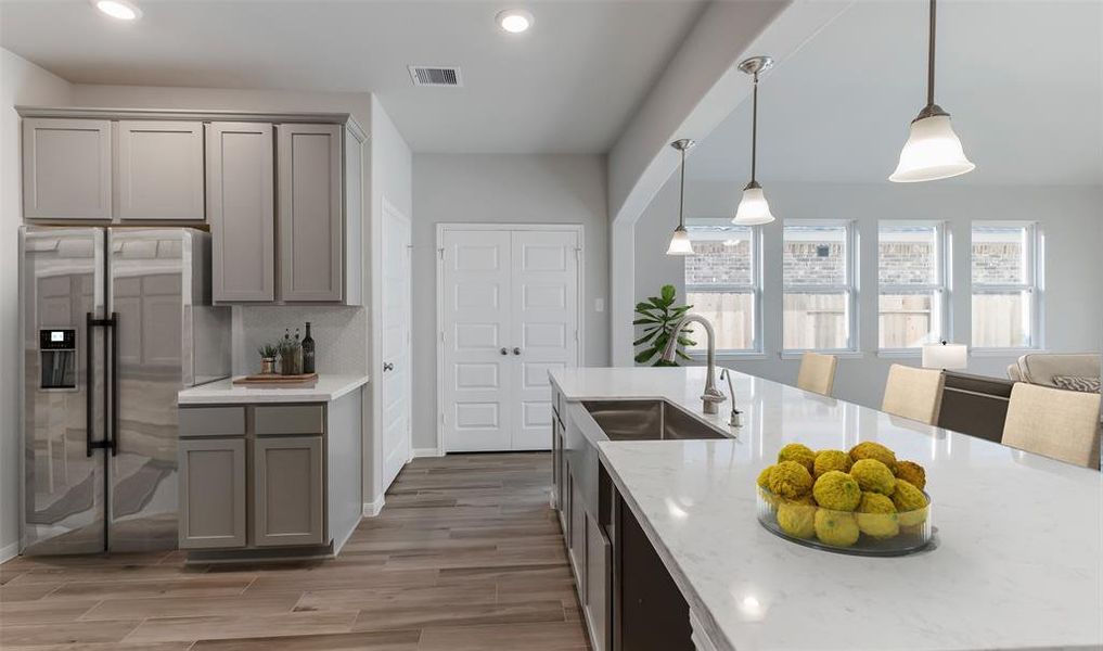 Kitchen with island (*Photo not of actual home and used for illustration purposes only.)