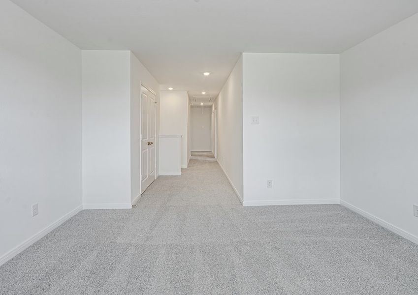Upstairs game room with lush carpet